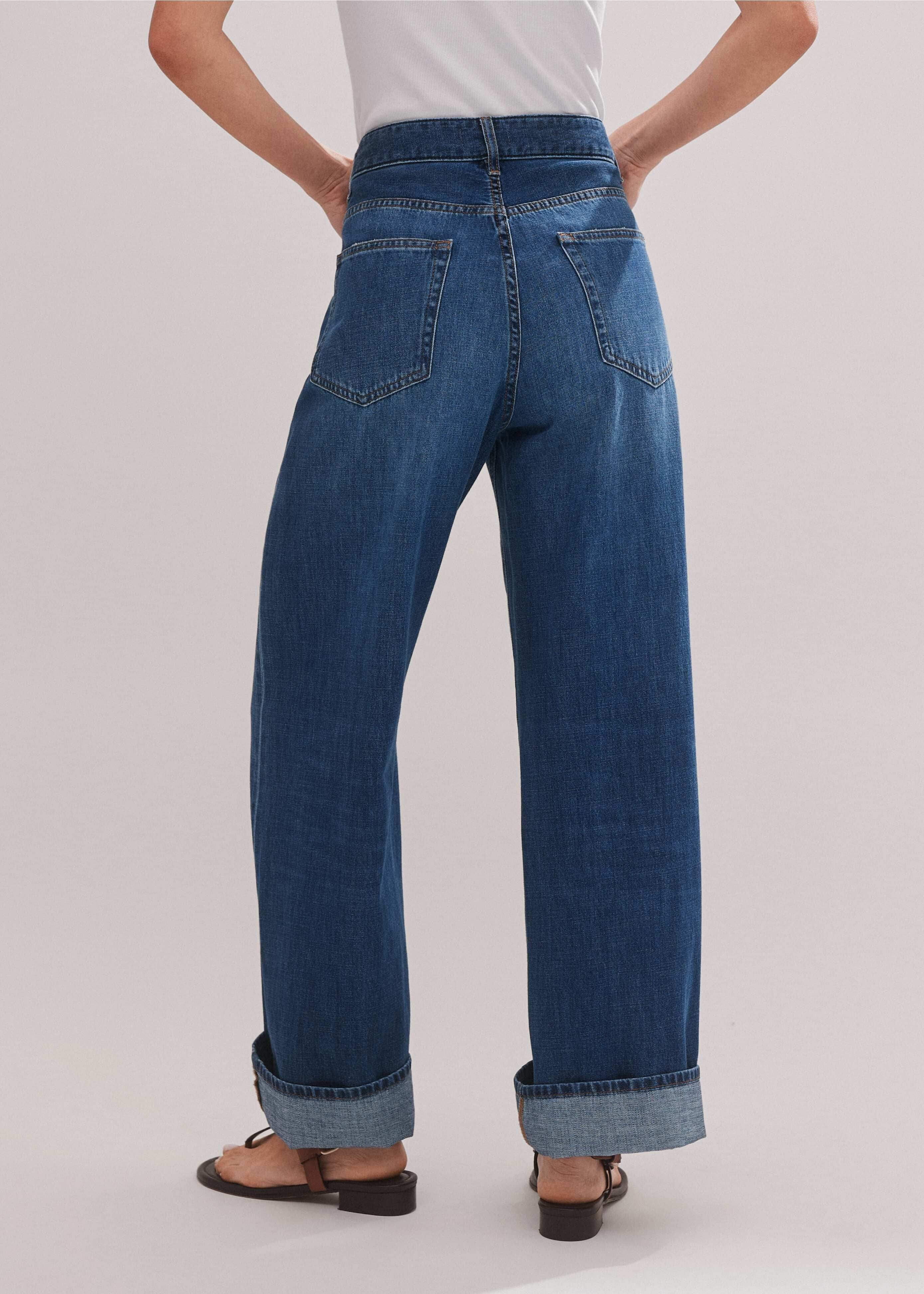 Crafted from pure-cotton denim in an authentic mid-blue wash detailed with subtle fading and whiskering.