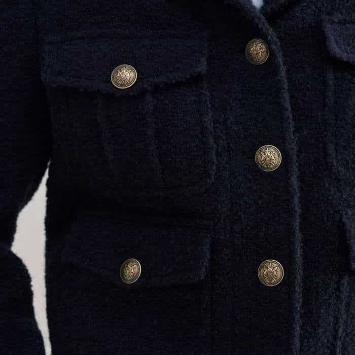 Topped with buttons, four pockets feature on the single-breasted front.