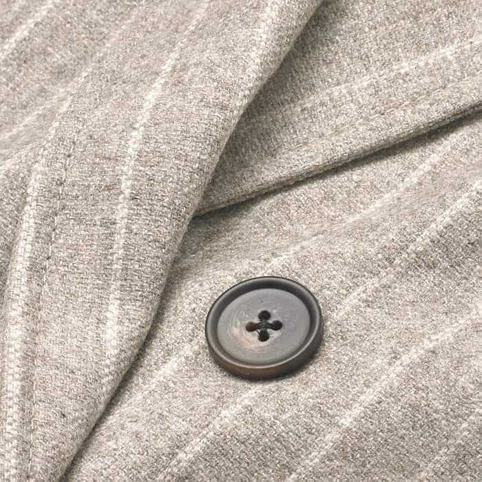 Italian wool-bend pinstripe tailoring in grey melange and cream.