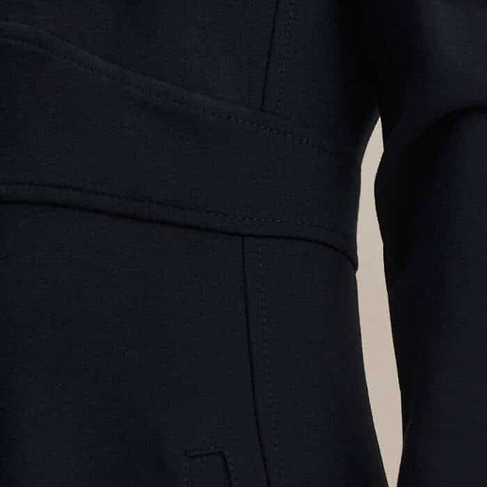 Seam detailing highlights the fitted waist and the tiered construction of the skirt.