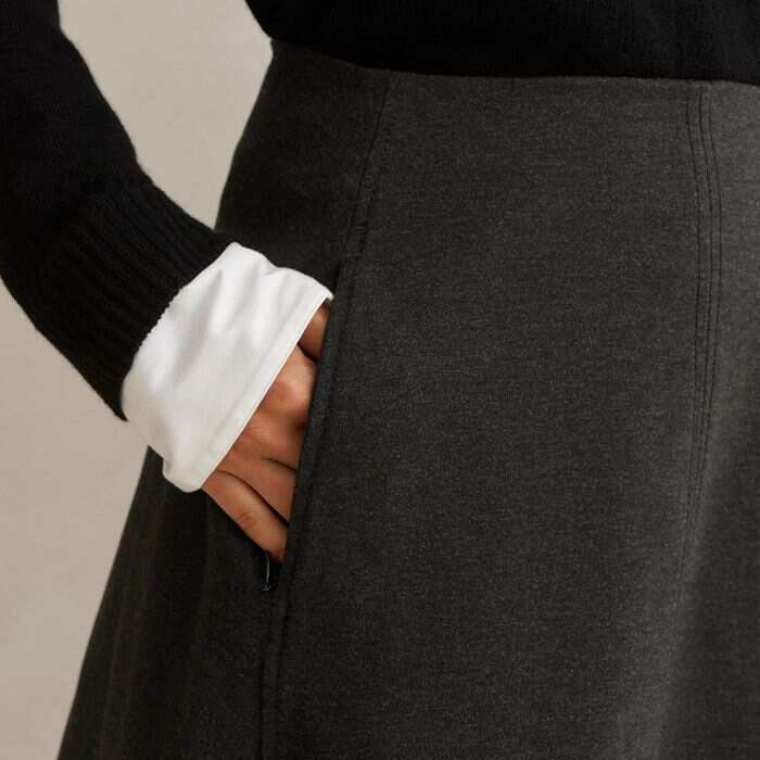 Signed off with zips, practical pockets are flatteringly positioned and keep small possessions safe.