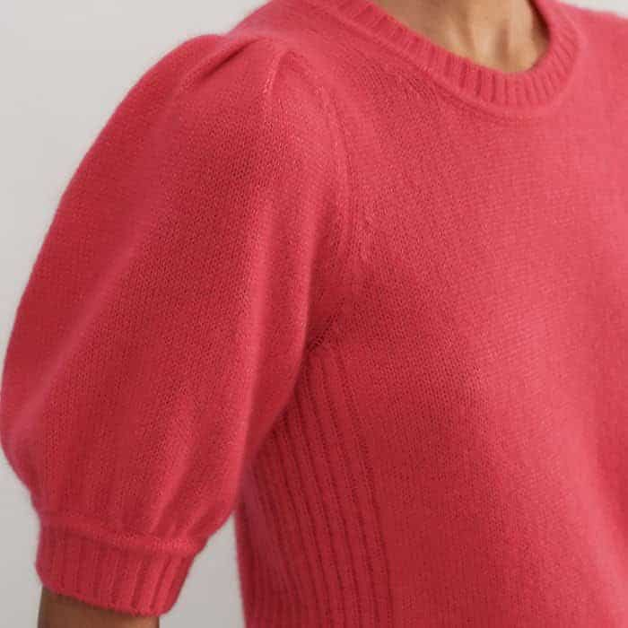 A pouf at the shoulder adds flattering volume to the sleeves.