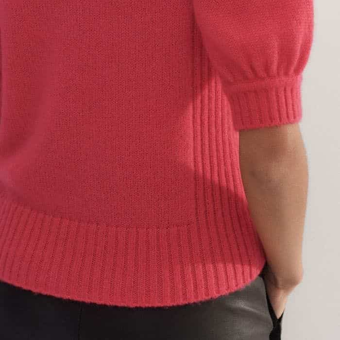 The neckline, cuffs and hem are ribbed to maintain the shape of the piece.