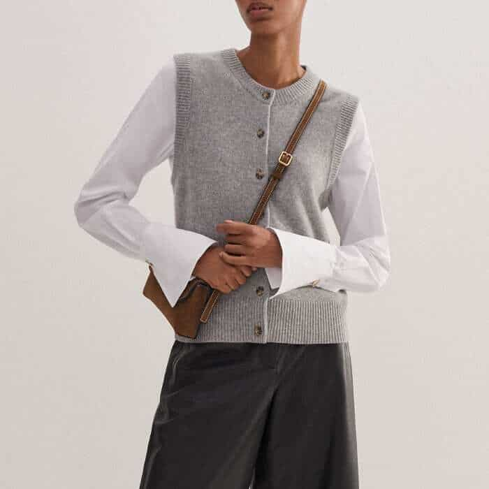 Flatteringly clash textures by layering our Cashmere Button-Through Vest over a crisp white shirt.