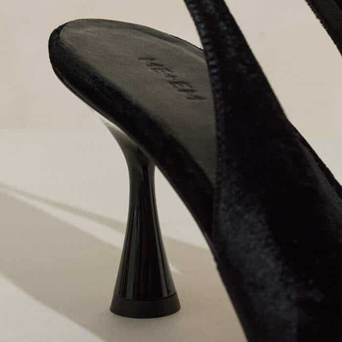 Set on a round base, the heel is sculpted to an almost hourglass silhouette.