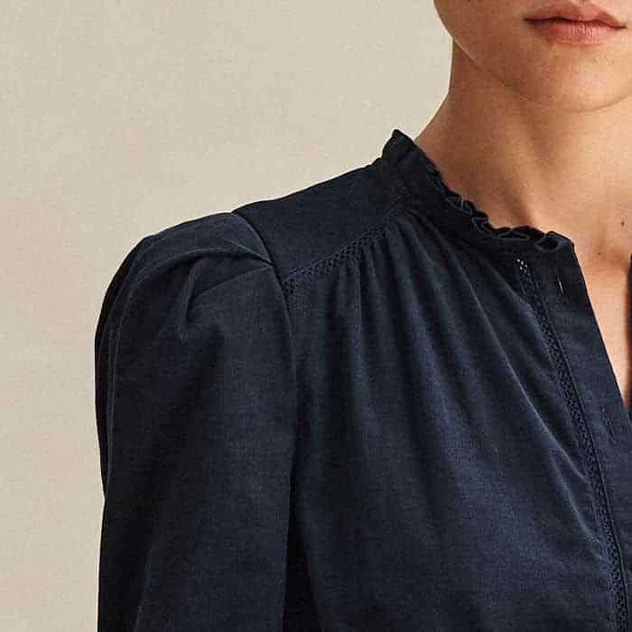 Gathered details on the shoulders create a flattering finish. 