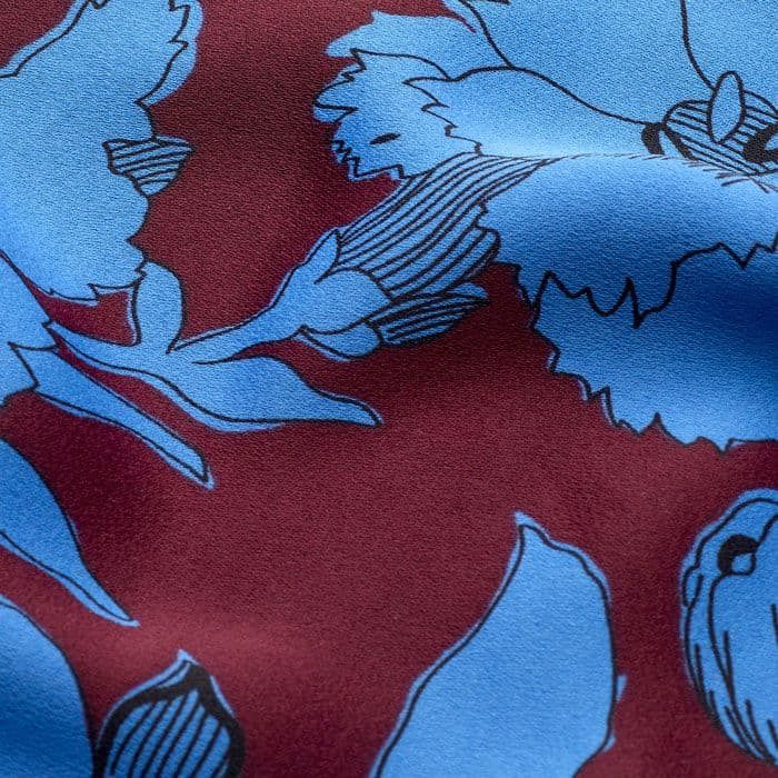 Heavyweight satin in 100% recycled composition features our statement scribble flower print that combines deep cabernet and blue.