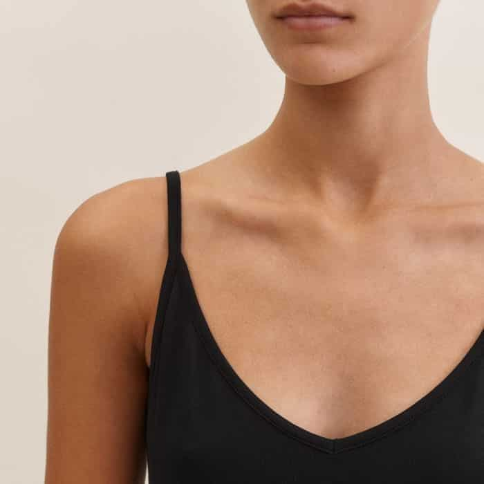 Framed by thin straps, the V-neckline complements dresses with the same neckline.