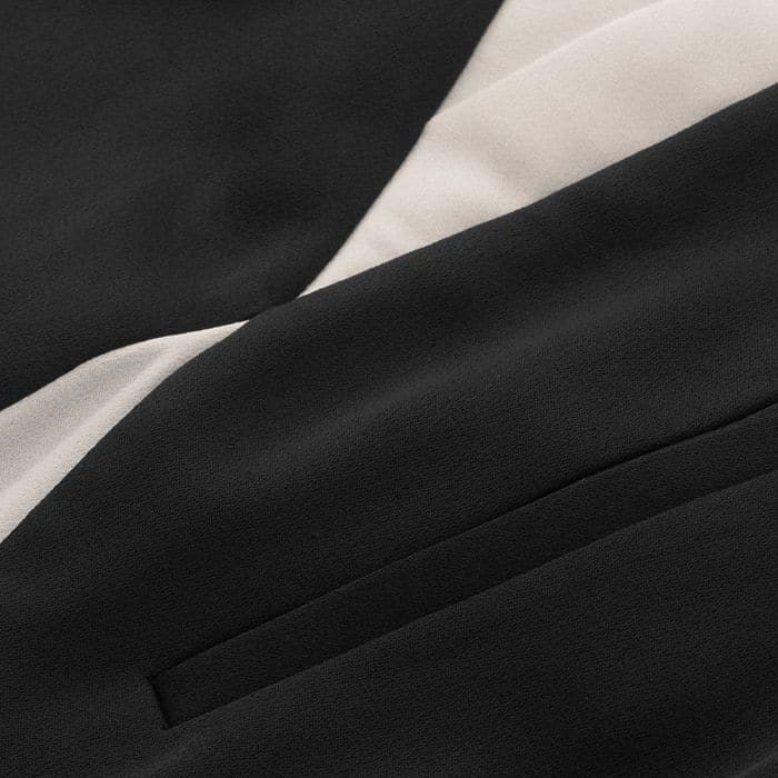 This sustainable, supersoft fabric is made from 100% recycled fibres. It features a combination of classic black and pale cream and uses the shiny side of the fabric for a luxe finish.