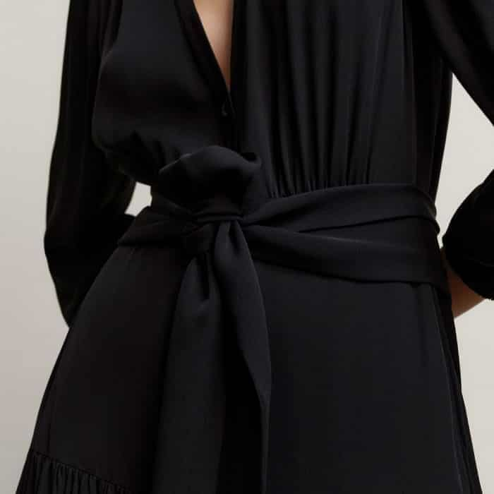 Highlight your waist with the optional belt or soften the neckline by styling it as a necktie.