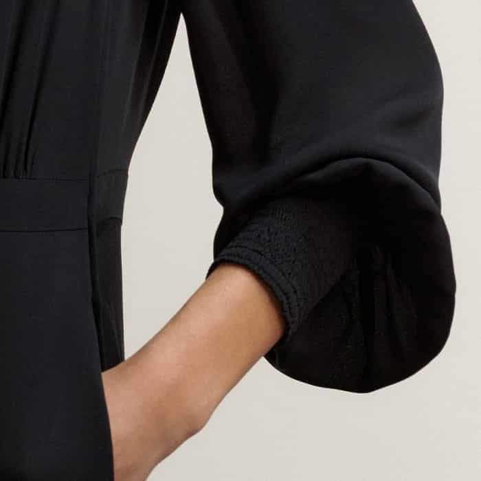 The cuffs fit close to your wrists, emphasising the drape of the balloon sleeves.