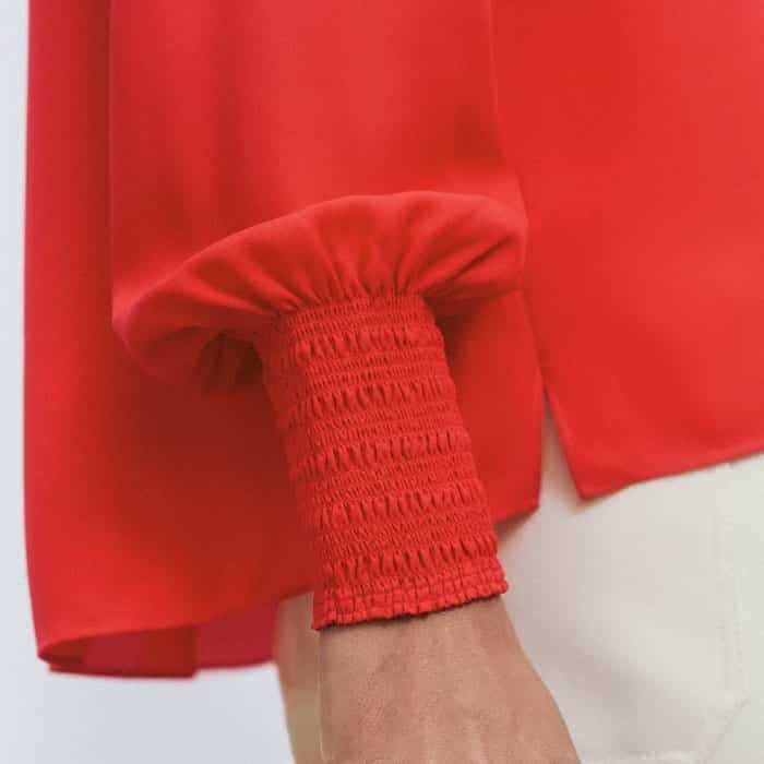 Emphasising the balloon sleeves, the deep elasticated cuffs are detailed with shirring.