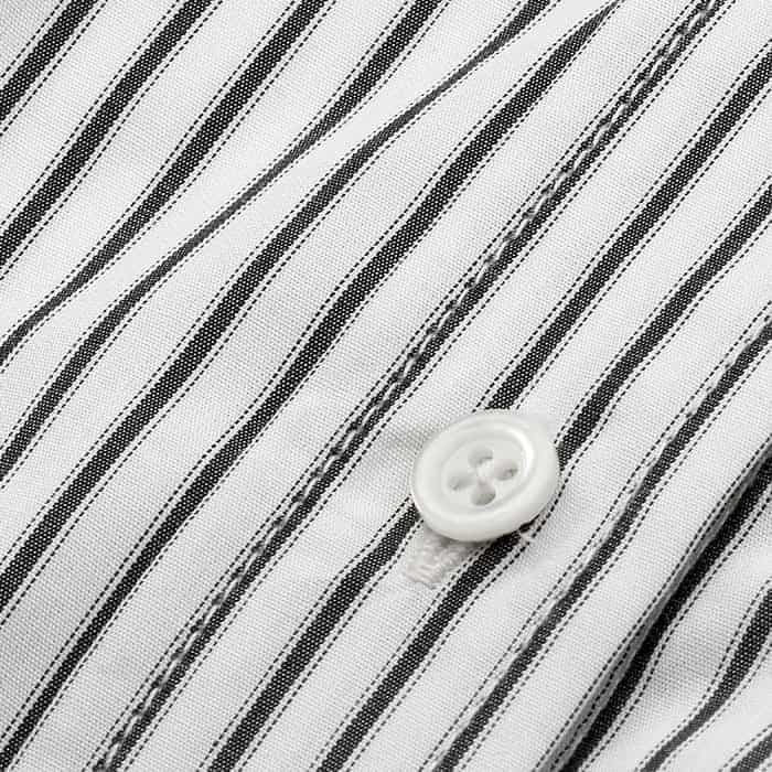 100% cotton in a black and soft white stripe.