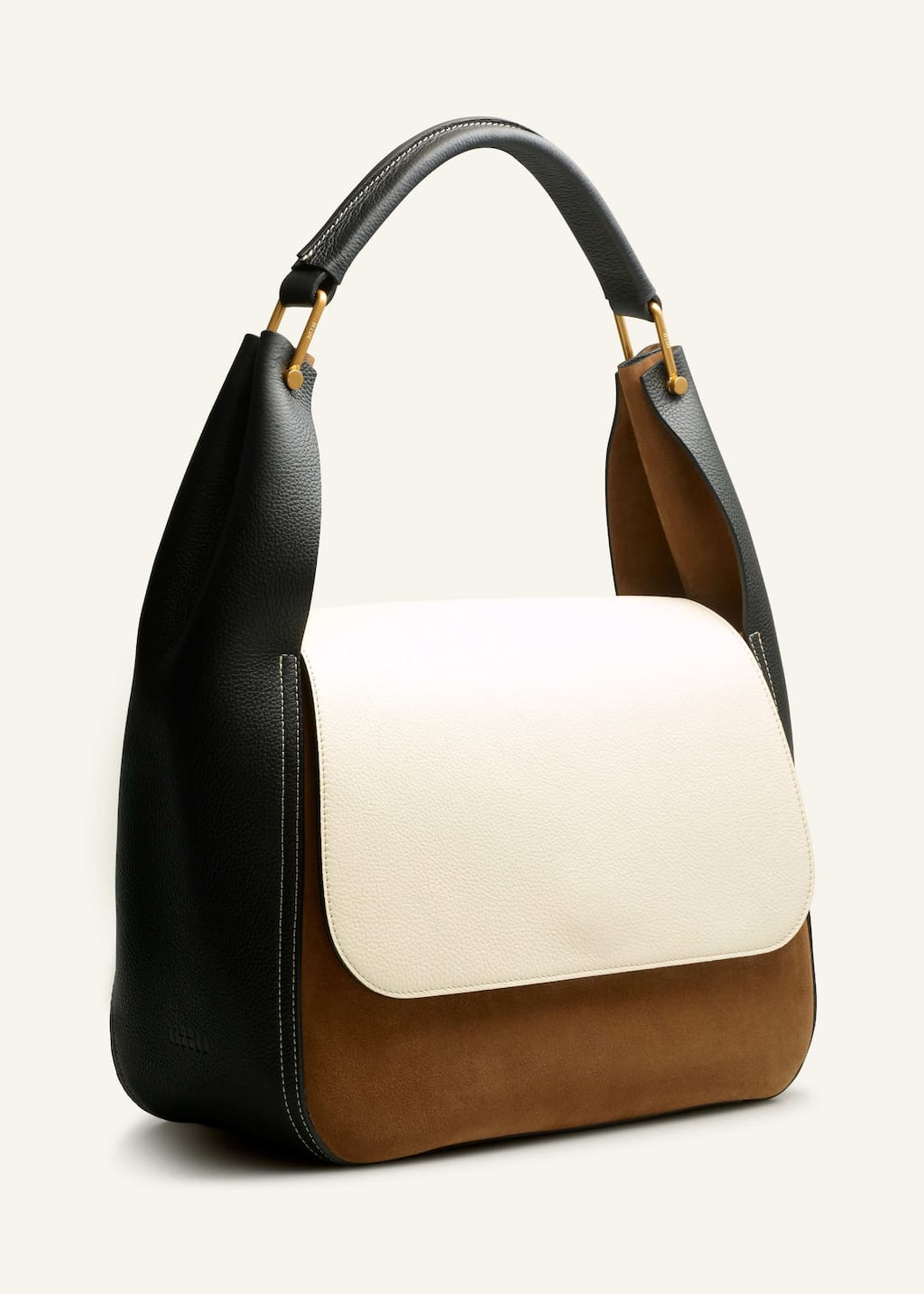 The sides of the bag are ruched to create a modern, sculptural finish whilst also accommodating more belongings.