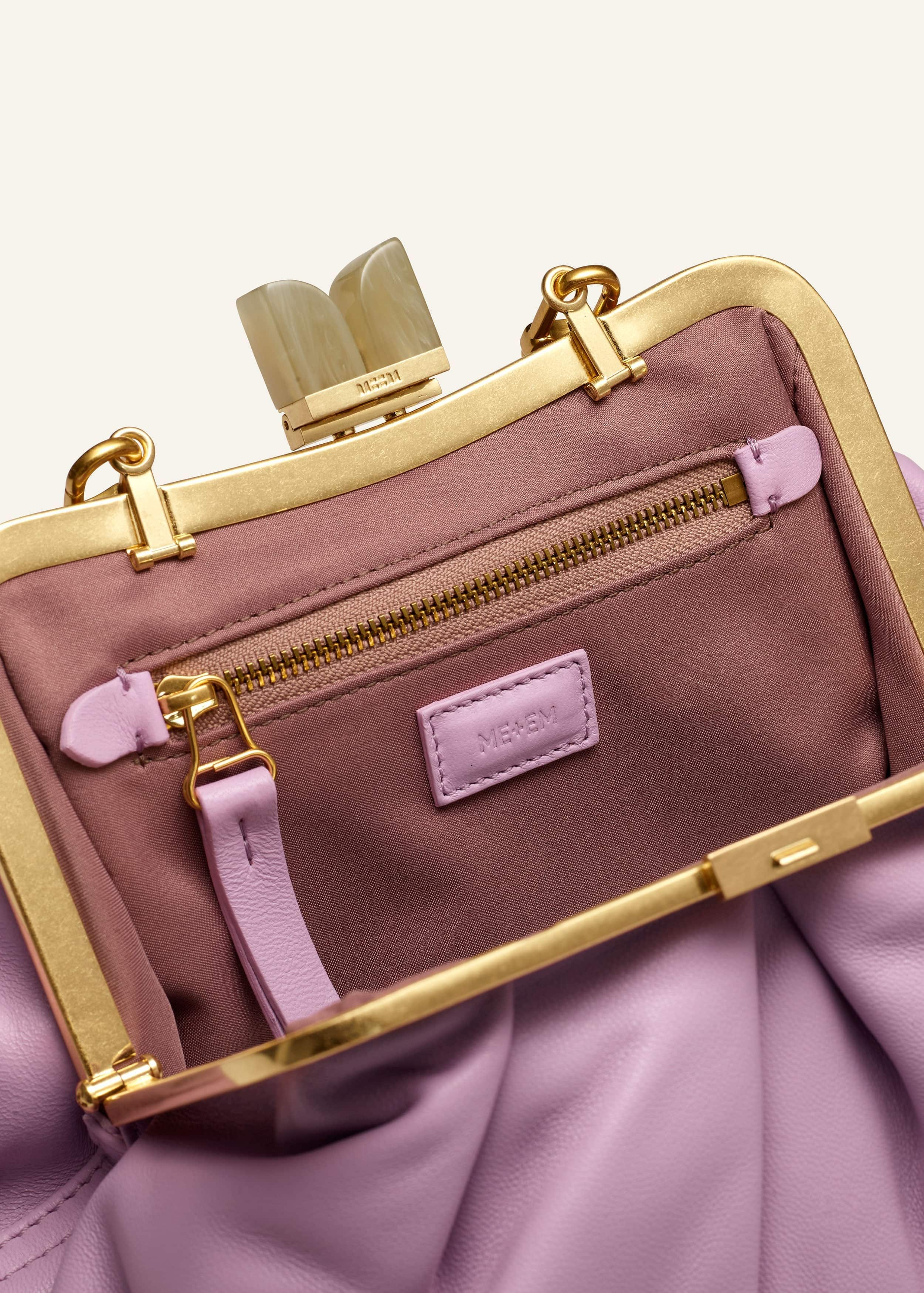 Engineered to accommodate all your belongings, the ruched shape creates more space for evening essentials.