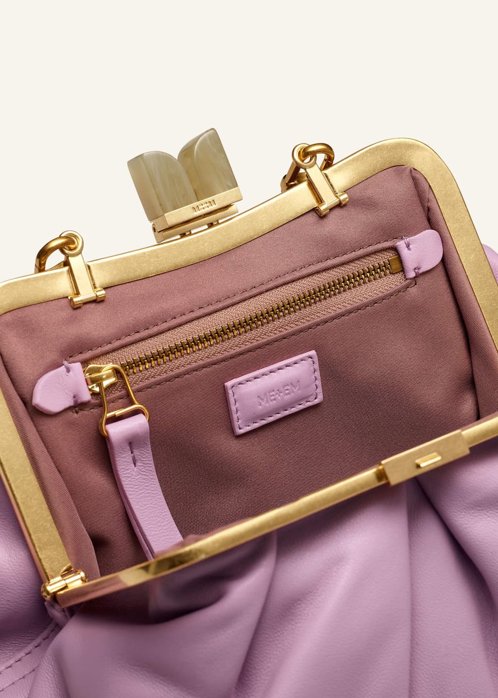 Engineered to accommodate all your belongings, the ruched shape creates more space for evening essentials.