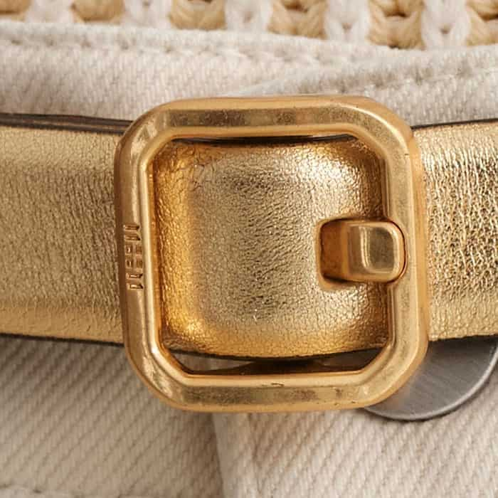 The gold-plated buckle is enhanced with abstract ME+EM block branding.