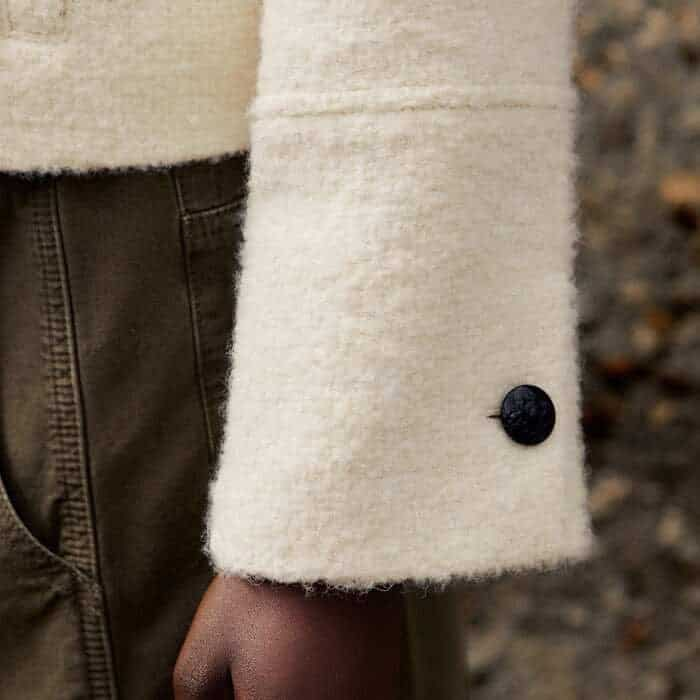 The button at the cuff can be undone to turn back the sleeves for a more relaxed finish.