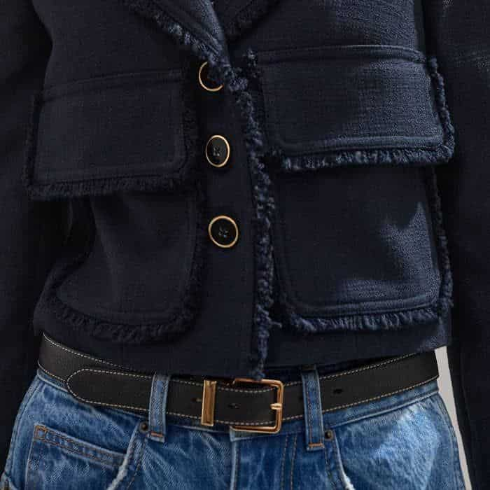 Adding functionality, large patch pockets are positioned either side of the button-down front.