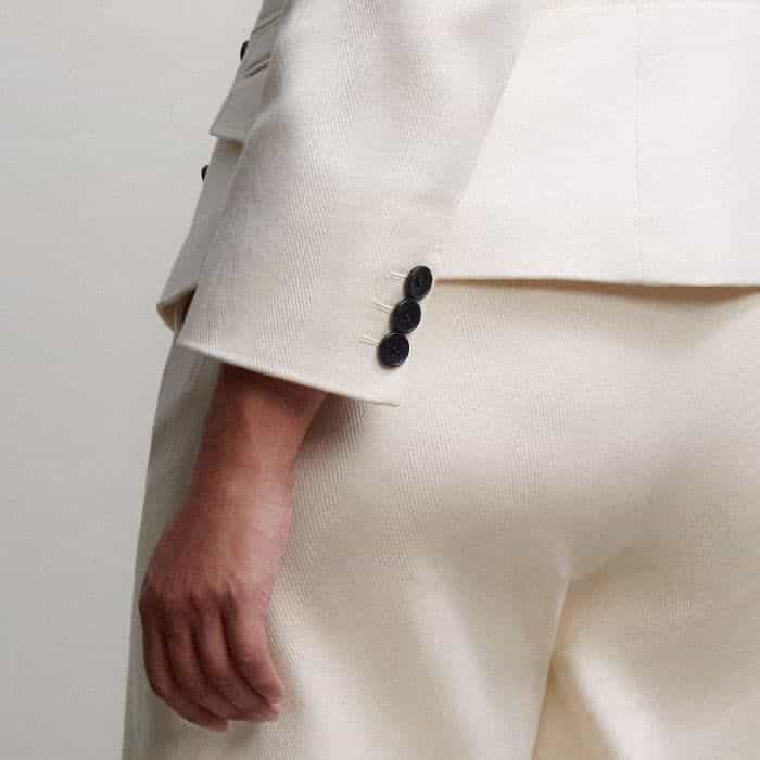 The slightly cropped sleeves allow detailed cuffs and jewellery to be left on display.