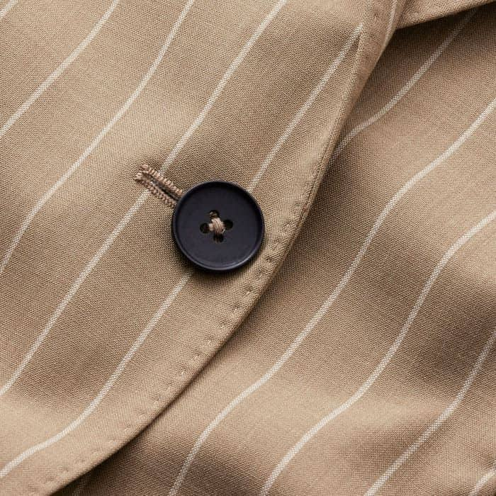 Crafted from a lightweight wool-blend pinstripe fabric.