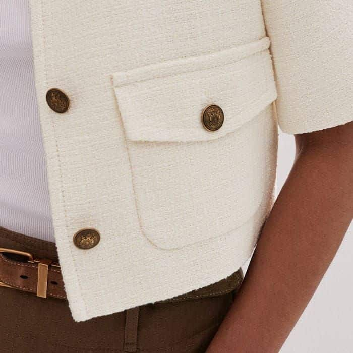 Pockets either side of the button down front add functionality.