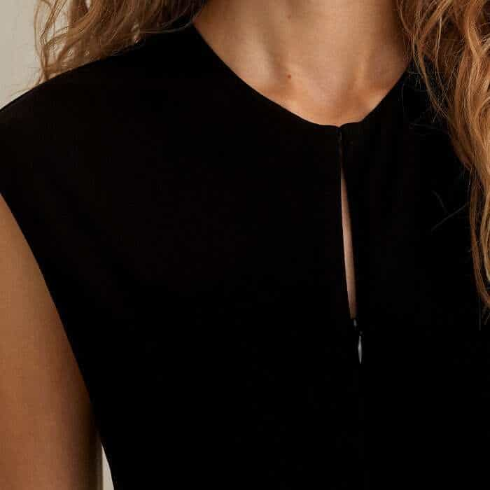 Choose between a V-neckline and high crew neck with the zip-up detailing.