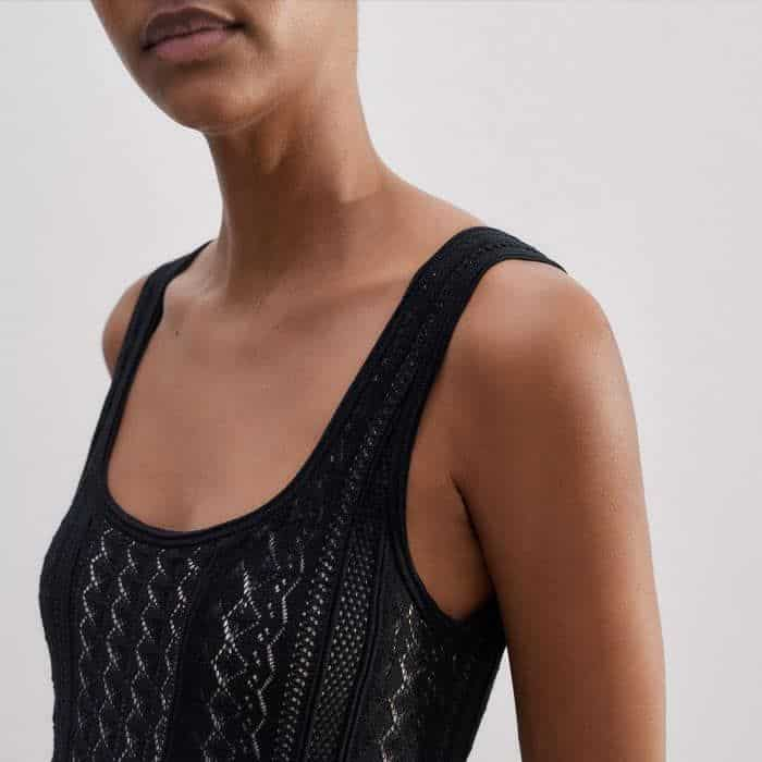 The scooped neck and back ensure a flattering finish.