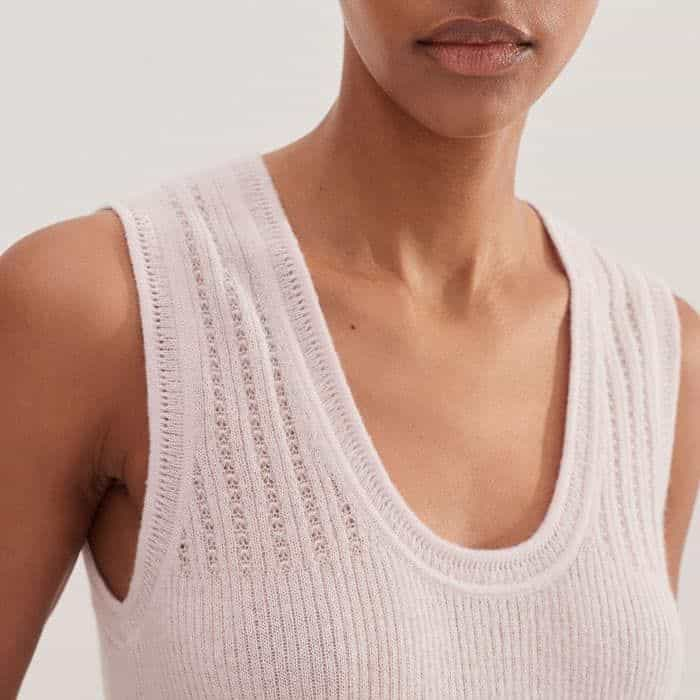 A delicate lace stitch decorates this piece for a feminine finish.