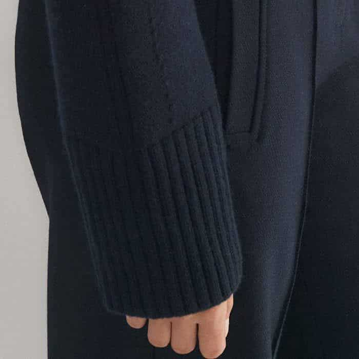 Signed off with a ribbed texture, the deep cuffs fall past your wrists and can be turned up.