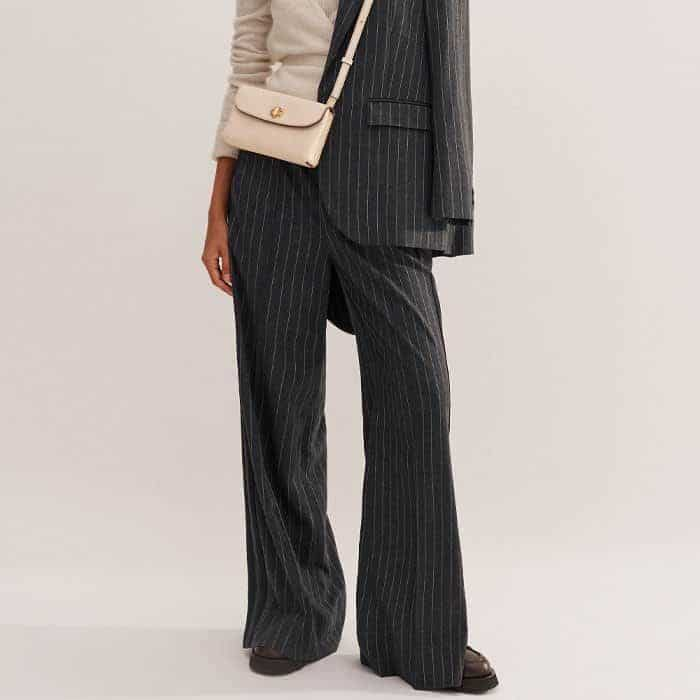 Add graphic interest to your look with our Pinstripe Wide-Leg Track Pant.