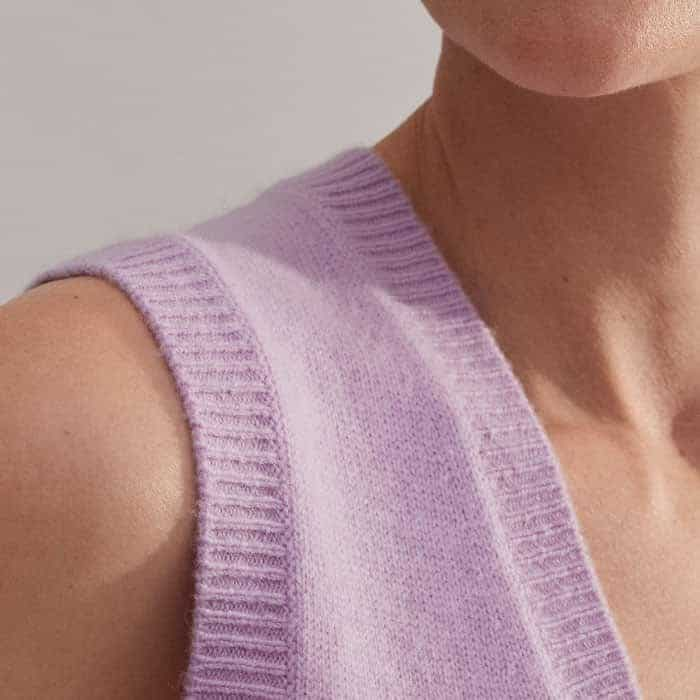 Ribbed trims at the hem, neckline and armholes maintain the fit of the piece.