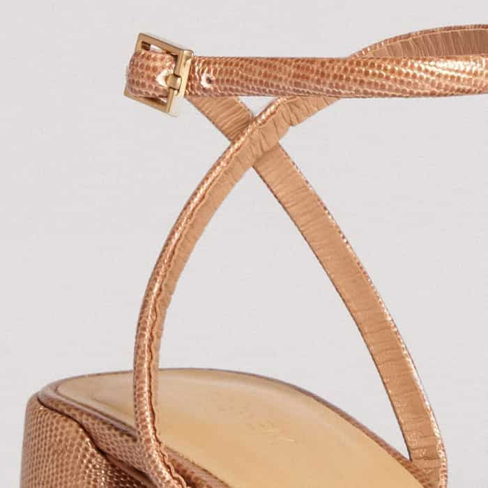 The buckle at the ankle is crafted from gold-toned hardware for a luxe finish.