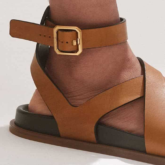 A gold-plated buckle at the ankle can be adjusted to perfect the fit.