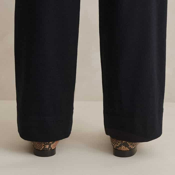 Deep hems that can be let down or turned up alter the length of the legs to complement all heights.