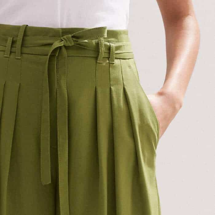 Front pockets are flatteringly positioned in front of the side seams to avoid adding excess bulk and they are accompanied by back pockets with button details.  