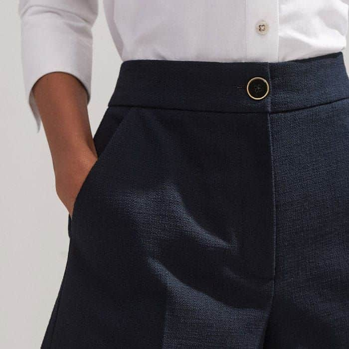 Adding functionality without excess bulk, pockets are flatteringly positioned in front of the side seams.