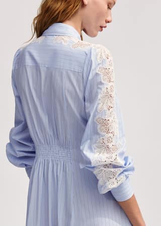 Crafted from cotton in a blue and white stripe, featuring statement lace at the sleeves.