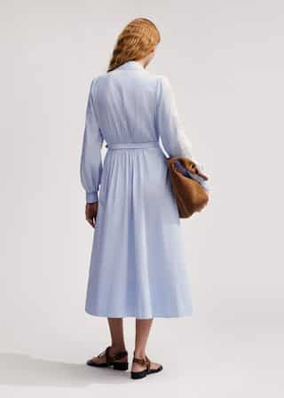 Crafted from cotton in a blue and white stripe, featuring statement lace at the sleeves.