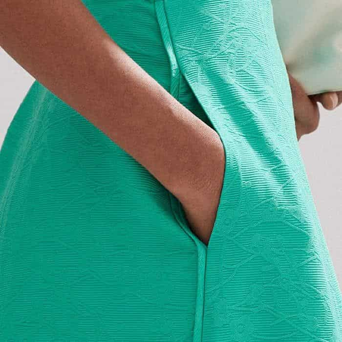 Pockets find a home in front of the side seams for a bulk-free, functional finish.