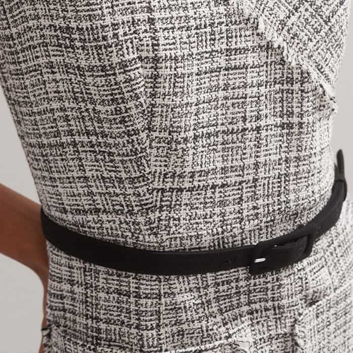 Add the black belt to your look to cinch in your waist.