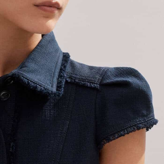 For a sleek, flattering finish, the sleeves have a small pouf at the shoulder.