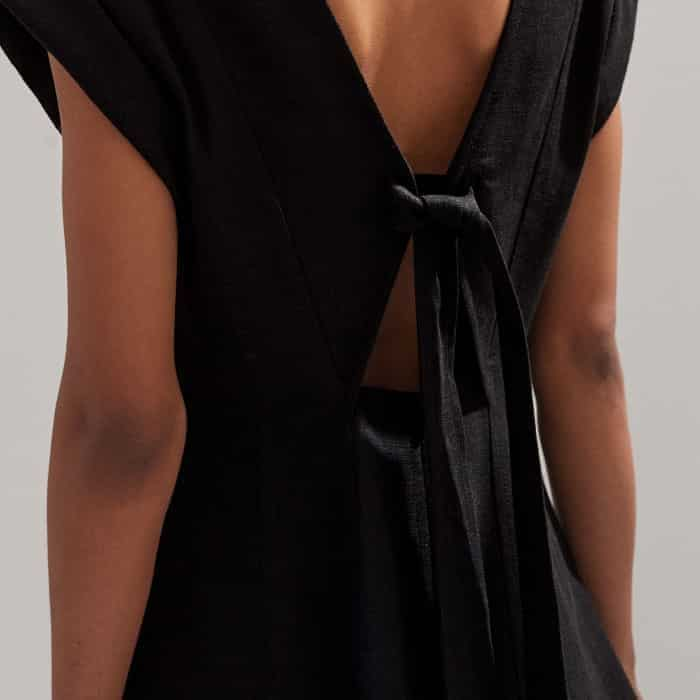 The back of the piece is elevated with a tie detail.