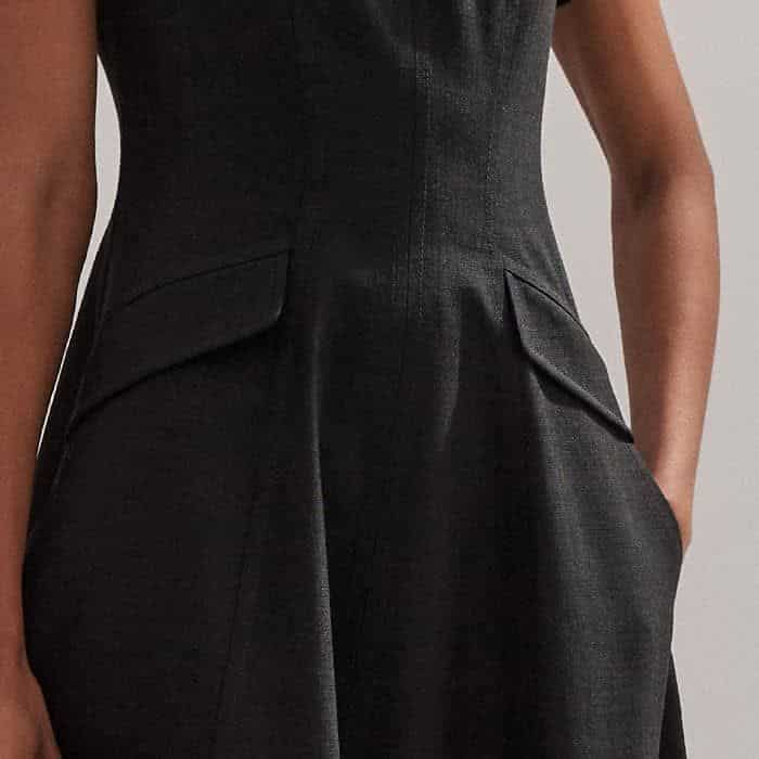 A welt, diagonal detail just above the pocket adds interest and structure to the silhouette.