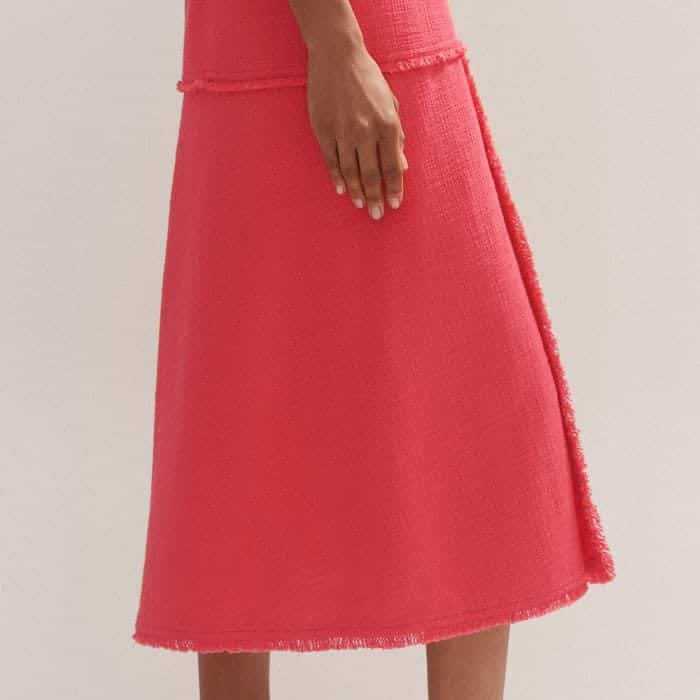 A subtle split towards the side of the skirt allows for ease of movement.