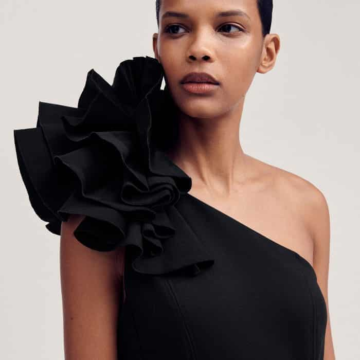 The corsage detail is attached with a pressed stud and can be added to the shoulder for a statement finish.