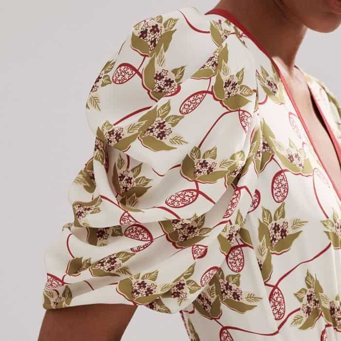 A pouf at the shoulder leads to flattering short sleeves.