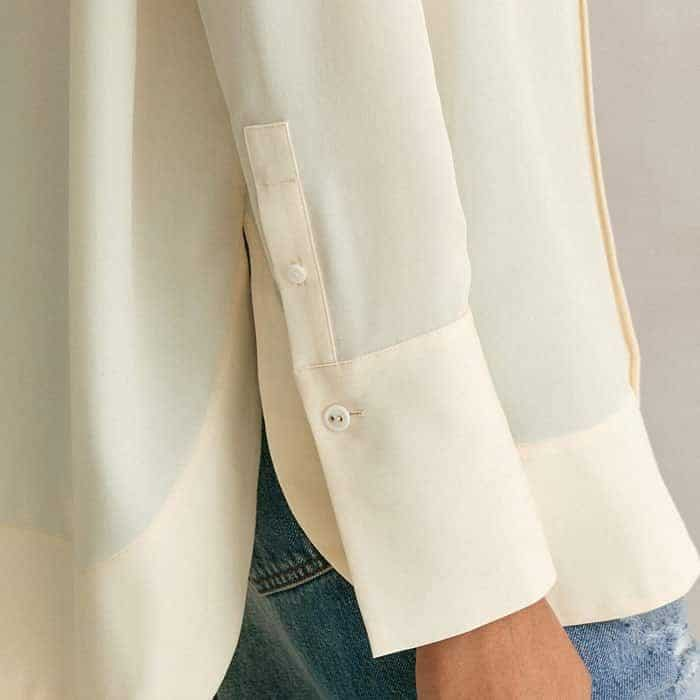 Button details at the cuffs allow you to turn back the sleeves for a more casual finish.