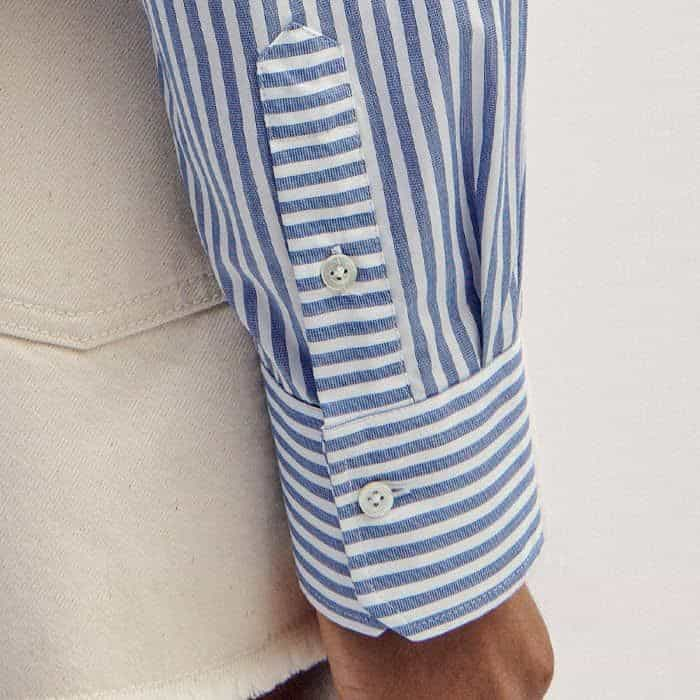 Deep cuffs with a button fastening allow the sleeves to be turned up for a more casual finish.