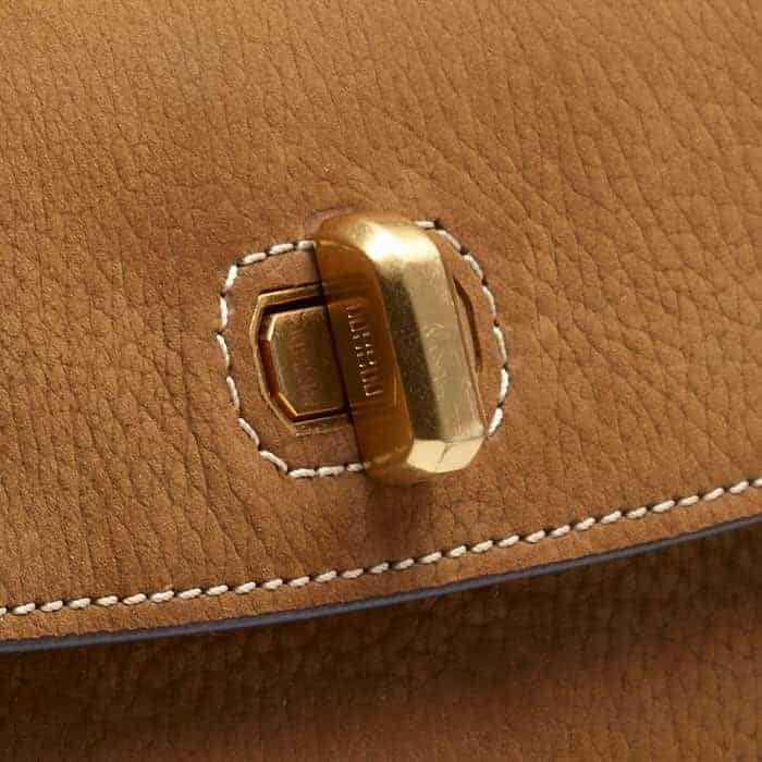 Bespoke block branding elevates the gold-plated twist-and-lock fastening.